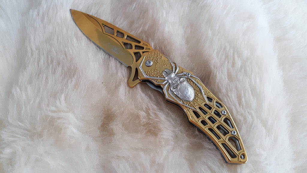 GOLD TITTANIUM COATED POCKET KNIFE W/CAN OPENER – Bama Paracord & More