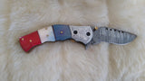 "ALL AMERICAN" DAMASCUS CAMEL BONE FOLDER W/CROSS DRAW SHEATH